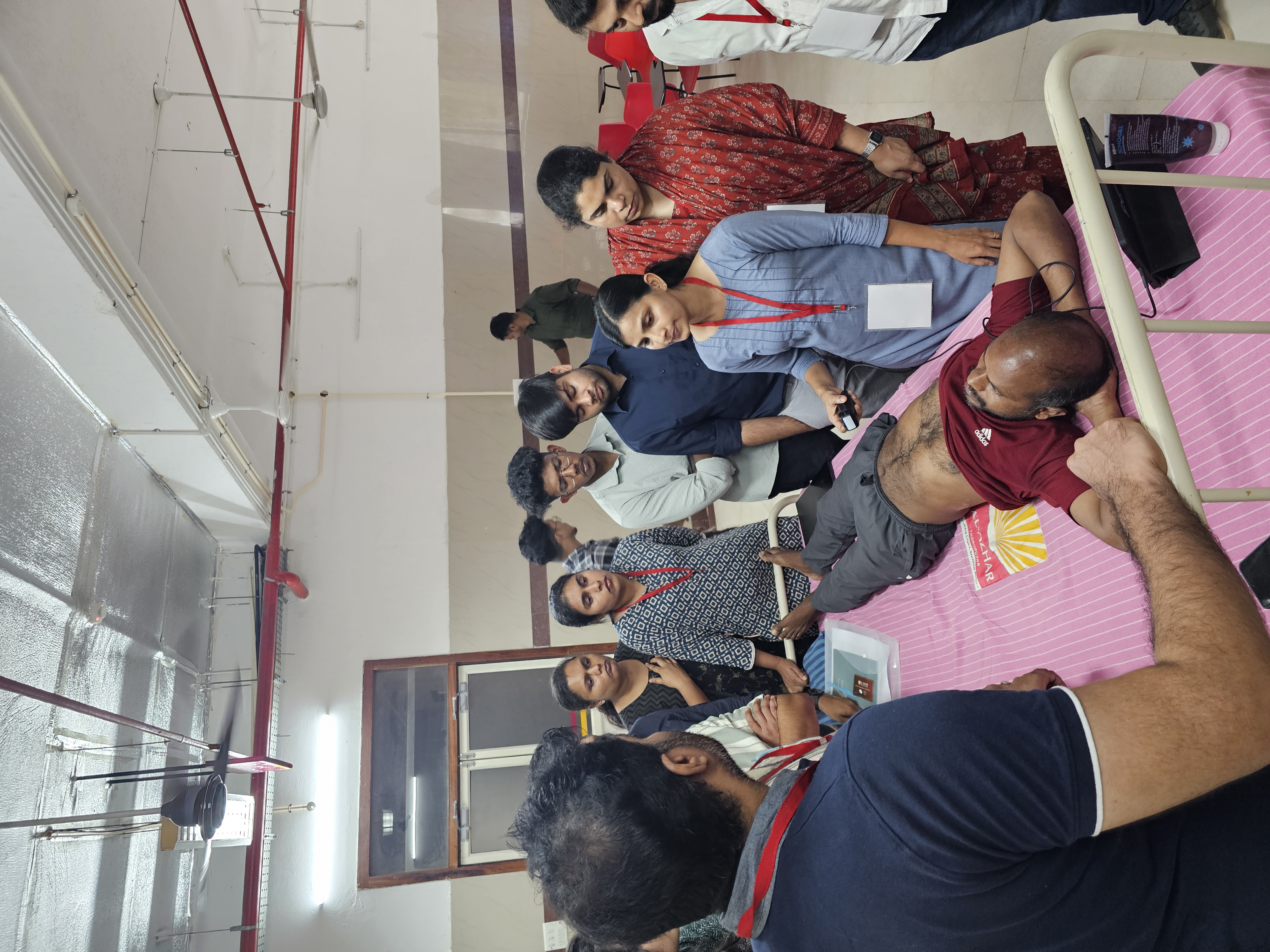 Participants practising point-of-care ultrasound skills at the bedside